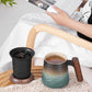 A pressed ceramic tea cup with a filter and lid, with a capacity of 14.5 ounces, a wooden handle. It is a gift set suitable for tea lovers, including a tea infuser cup and a filter.